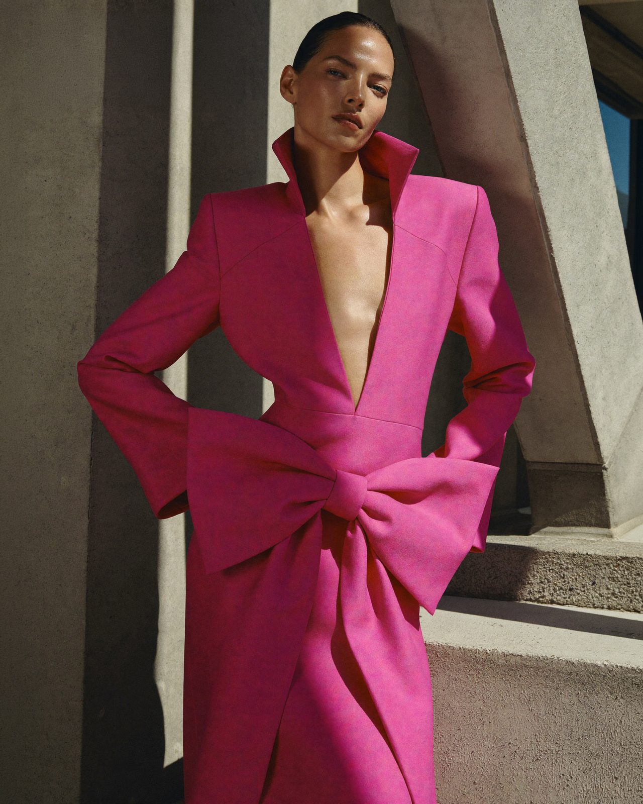 JANVIER Studio frame — fuchsia tailoring against concrete